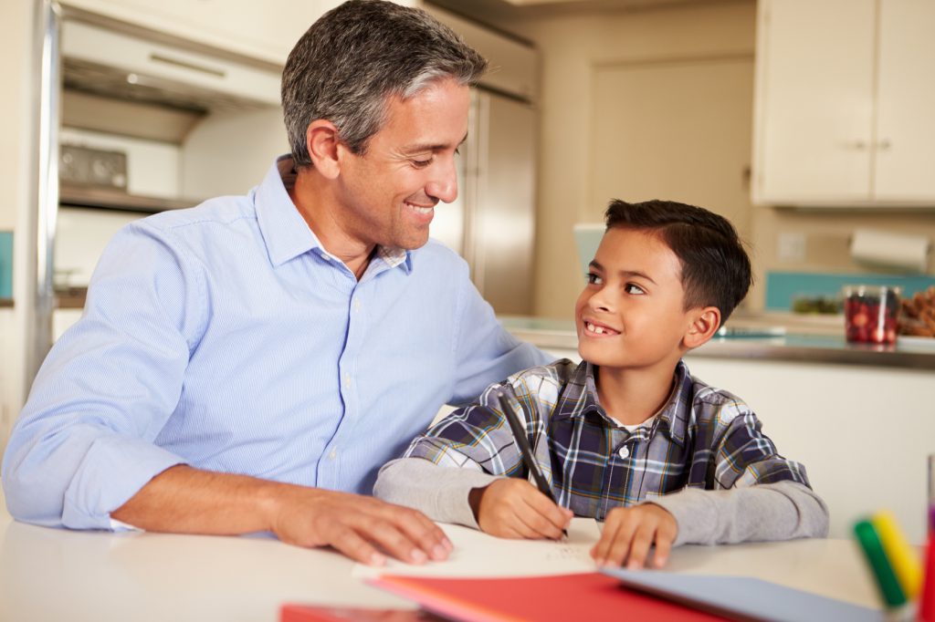 He helps his father. Сын на испанском. Стол для сына и отца. Сын Испании. Son helps father.